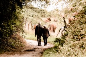 old couple walking hand and hand