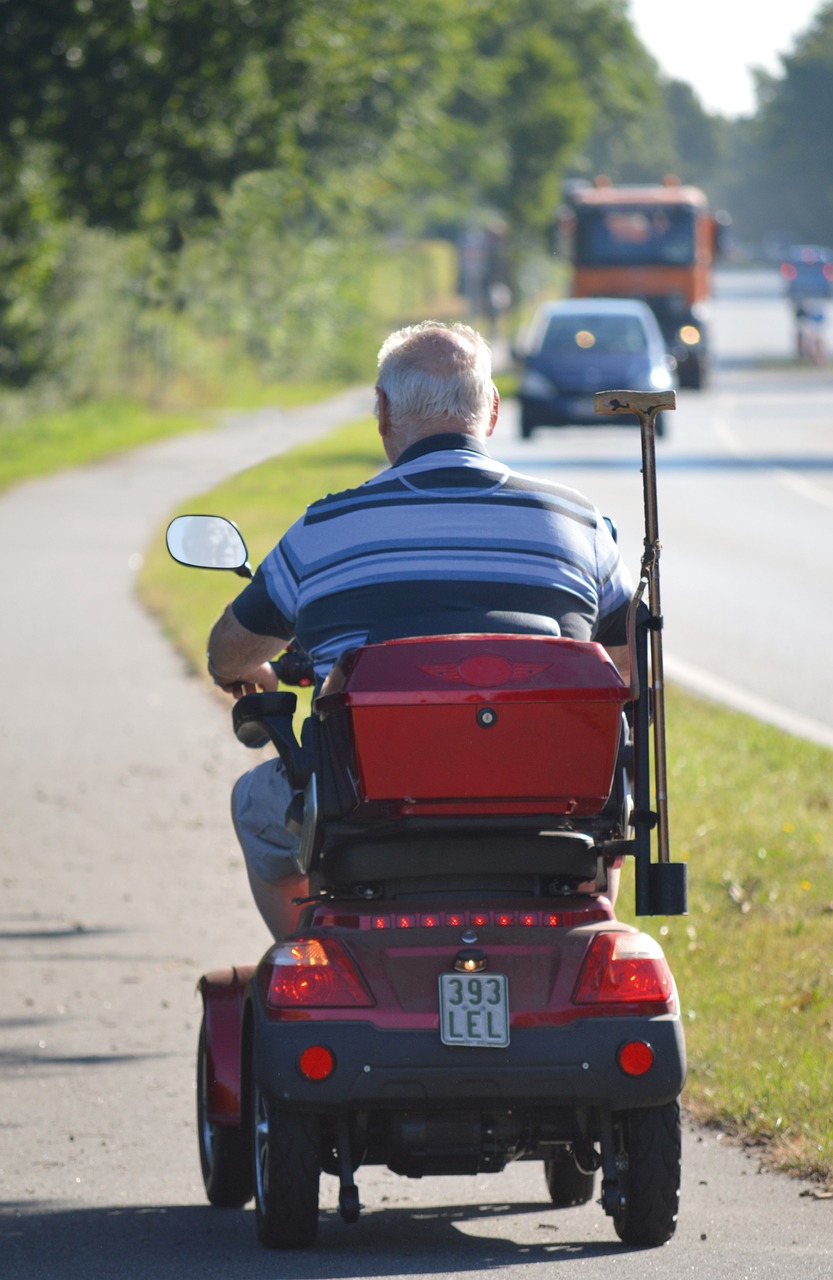 man on mobility scooter facing away